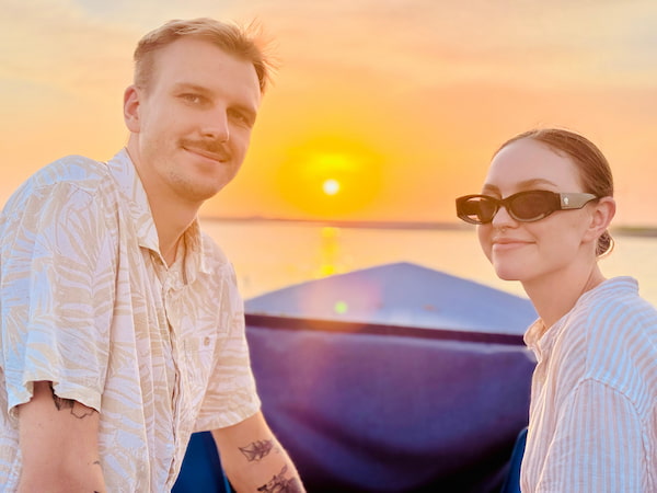 Young Couple Watching Golden Sunset